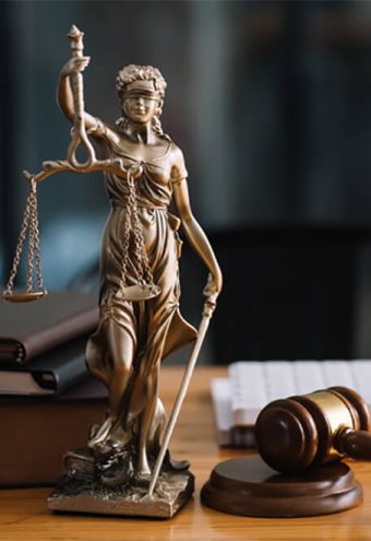 statue-of-lady-justice-on-desk-of-a-judge-or-lawye-SVECXT5-intro